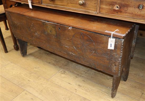 A William III boarded oak sabre chest, dated 1694, later top W.115cm